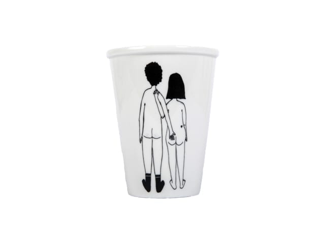 The Couple Cup - Back is a white ceramic mug with an Estonian design: a black line drawing of a naked man and woman holding hands, centred on the mug. A distinctive Tallinn shopping idea, shown against a plain white background. Gate21.ee