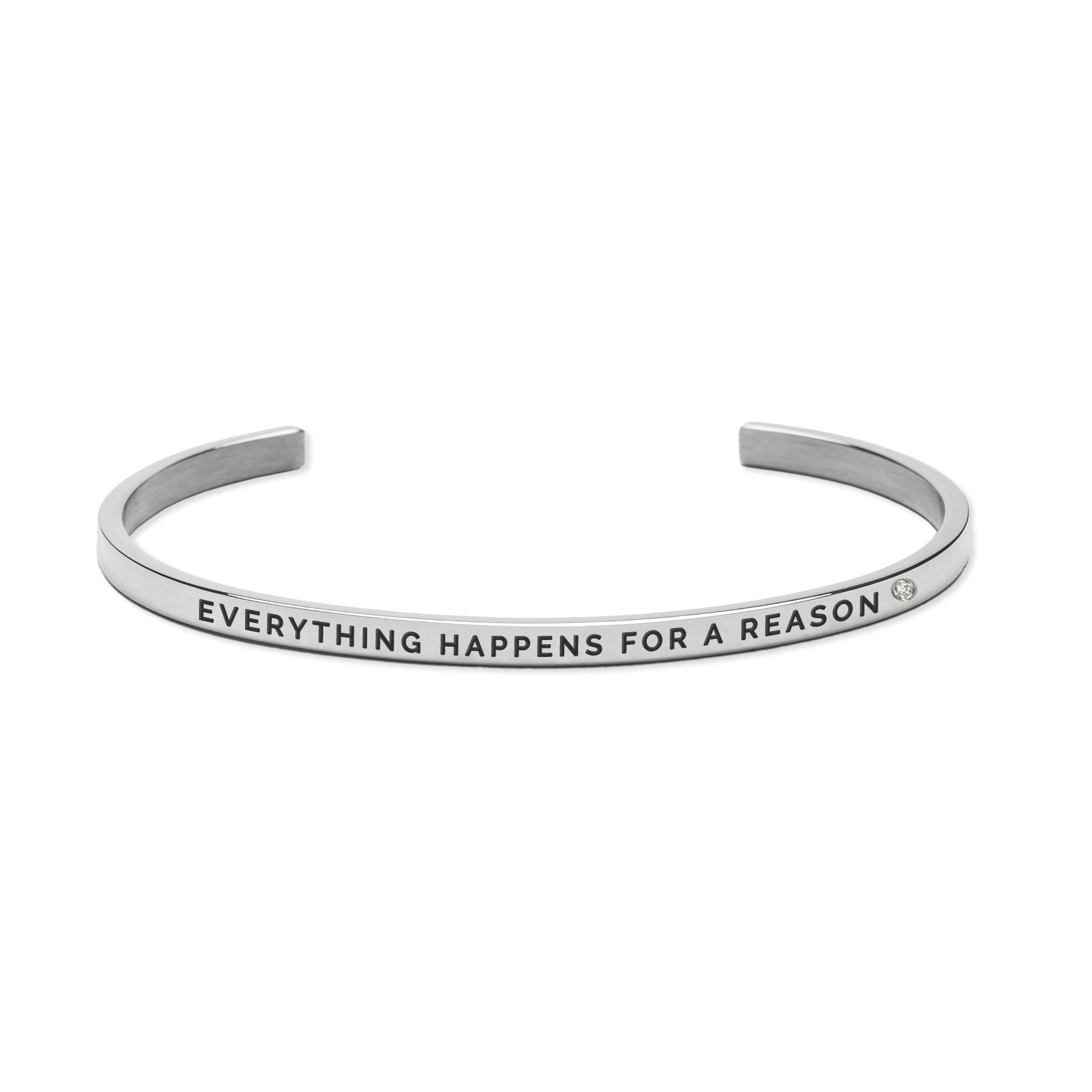 A silver cuff bangle with the engraved text EVERYTHING HAPPENS FOR A REASON and a small round stone accent near the end, curated for our gift shop and inspired by timeless Estonian design. Gate21.ee
