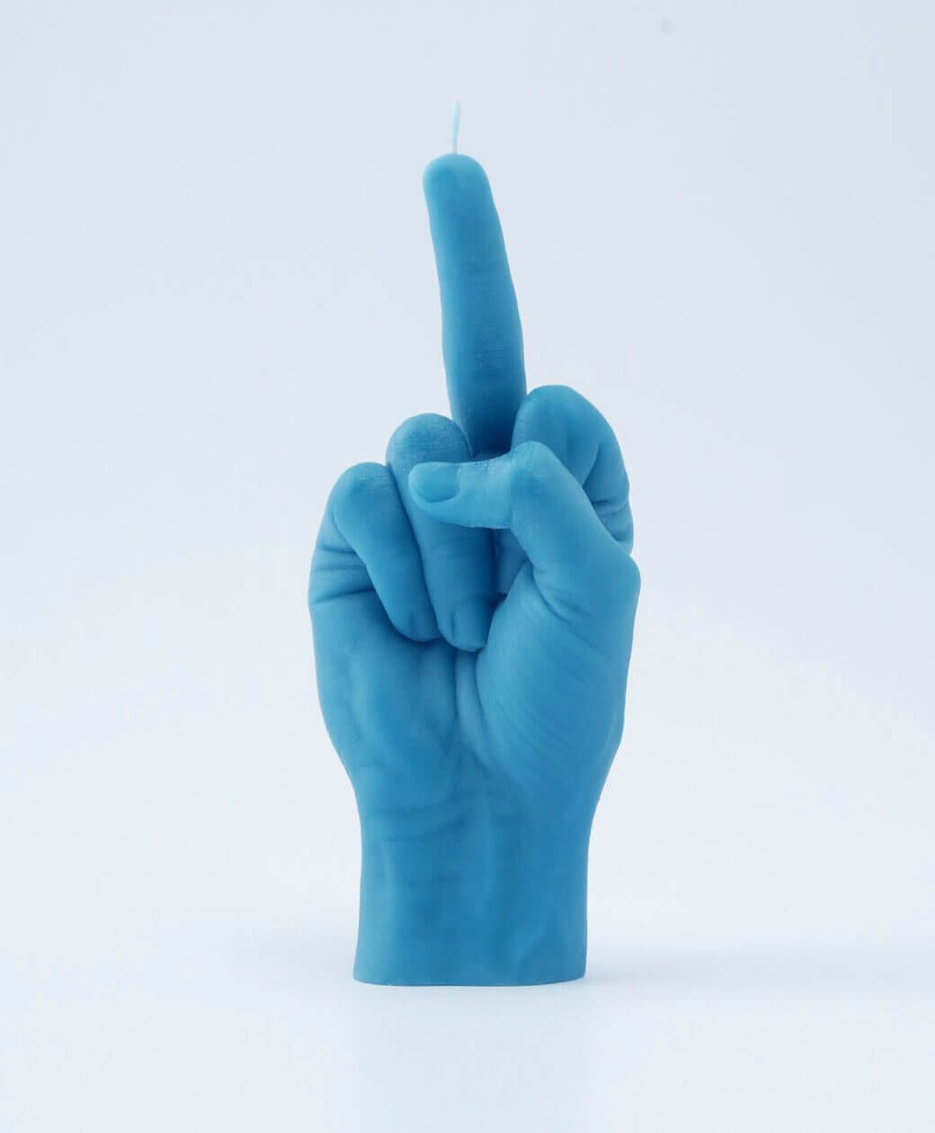 The F*ck You Candle - Black is a bold Estonian design shaped like a human hand giving the middle finger—making it an edgy, standout piece ideal for gift shops or concept stores. Gate21.ee