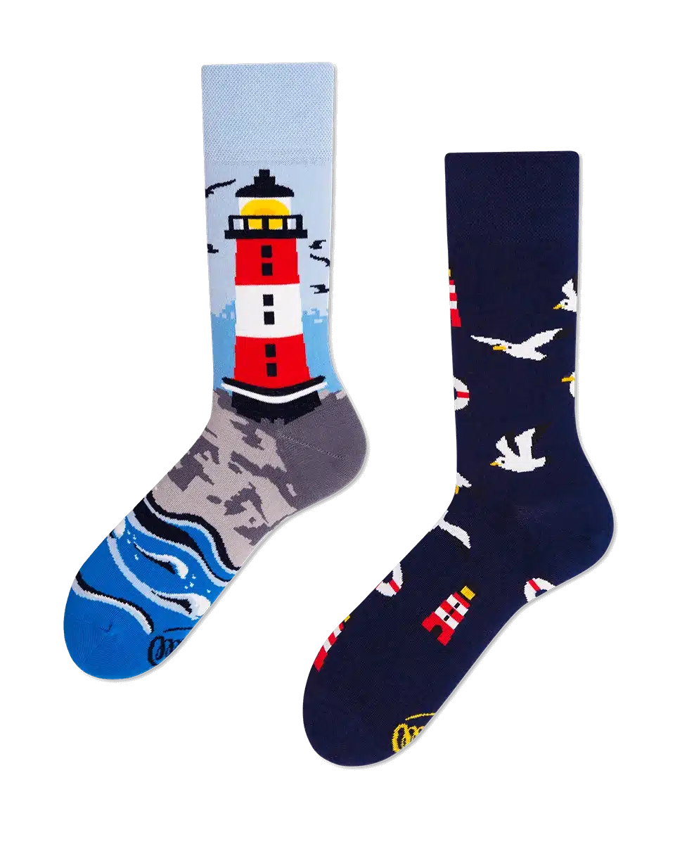 Nordic Lighthouse: A pair of mismatched socks—one with a red and white lighthouse and waves, the other with seagulls and lighthouses. A unique Tallinn shopping shop find, perfect for gift shop lovers. Gate21.ee