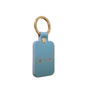 A rectangular black leather keyring with a gold keyring, featuring a minimalist line drawing of two breasts—Boob Key Ring - Black is perfect for anyone looking for unique or standout accessories whilst shopping in Tallinn. Gate21.ee