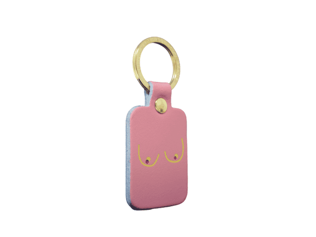 The Boob Key Ring - Black is a rectangular keyring with a gold metal ring and a minimalist line drawing of two breasts on the front—an ideal quirky find for any curated gift shop. Gate21.ee