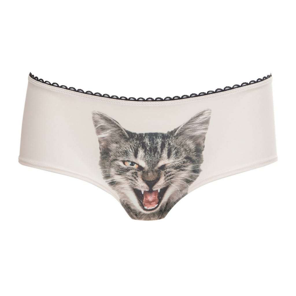 Winky Winky Cat Knickers are light-coloured women's underwear with a winking, open-mouthed cat face and scalloped trim—ideal for quirky style lovers browsing Tallinn shops or curated concept stores. Gate21.ee