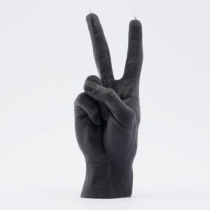 A black candle shaped like a human hand making a peace sign, with wicks at the raised fingers—an eye-catching piece of Estonian design, perfect for those seeking unique ideas or browsing your favourite gift shop. Gate21.ee
