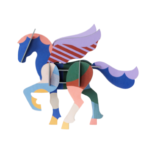 Adventurous Pegasus is a multicoloured paper sculpture of a winged horse, crafted from flat interlocking pieces in red, blue, purple, pink, green, and yellow—ideal for curated gift shops or concept stores. Transparent background. Gate21.ee