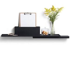 The Duplex Shelf from a curated concept shop displays a clipboard with paper, a glass vase of yellow flowers, a small glass jar filled with round objects, and scissors on the left, all set against a plain white background. Gate21.ee