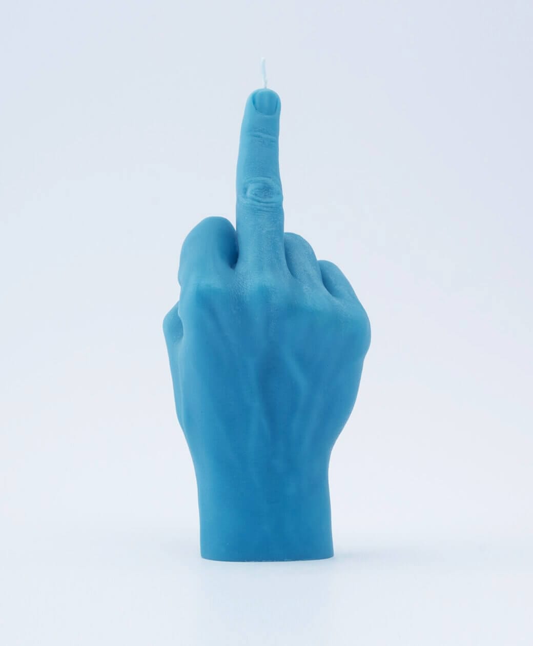 The F*ck You Candle - Blue is a bold, Estonian-designed candle shaped as an upright middle finger—perfect for adding edgy flair to your concept store or gift shop. Gate21.ee