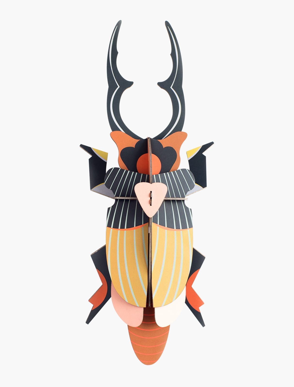 The Giant Stag Beetle is a vibrant 3D paper sculpture with striped wings and bold mandibles, featuring orange, yellow, black, and pink geometric shapes—an eye-catching Estonian design perfect for gift shops against a white background. Gate21.ee