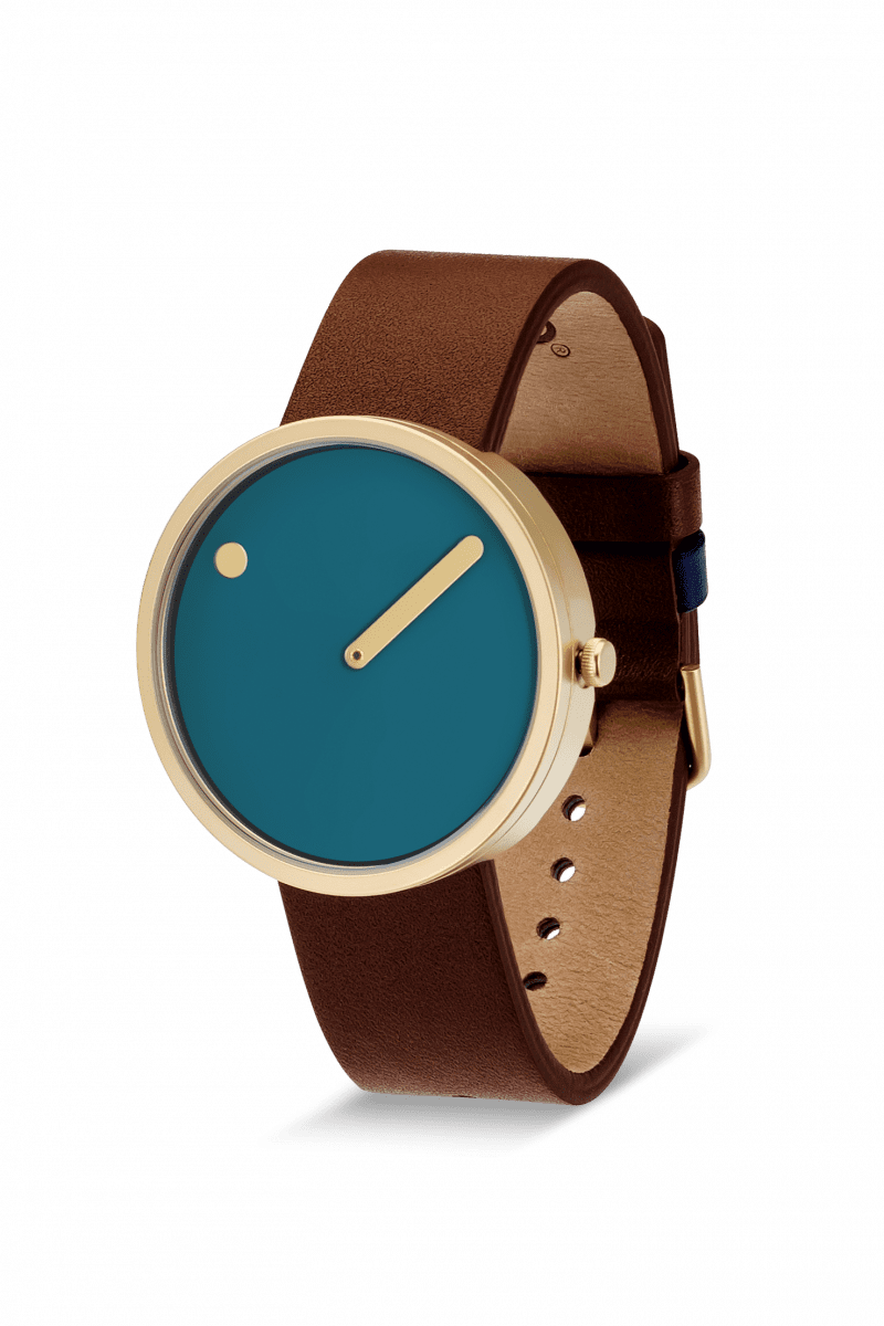 The Dusty Blue / Gold / 40mm watch features a round gold case, a minimalist blue face with a single gold hand and dot, and a brown leather strap—an elegant piece of Estonian design ideal for Tallinn shopping or as a unique present. Gate21.ee