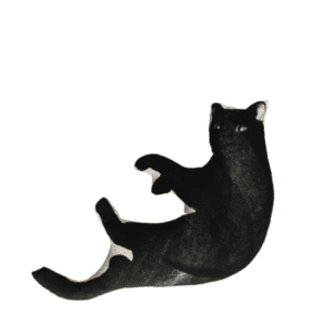 A Black Cat Cushion lies on its side with legs curled, gazing upward against a white background—embodying Estonian design charm and inspiring unique Tallinn shopping ideas. Gate21.ee