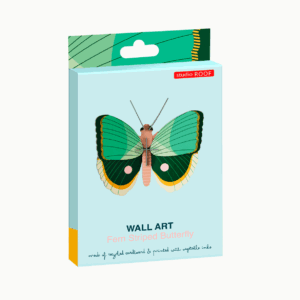 A rectangular box shows a green and pink striped butterfly illustration. Text reads "WALL ART Fern Butterfly" and notes Estonian design—made from recycled cardboard and printed with vegetable inks. Gate21.ee