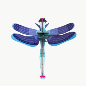 A curated, stylised paper dragonfly with blue and purple wings and a segmented blue body, set against a plain white background—perfect for those seeking unique ideas inspired by Tallinn shopping. Gate21.ee