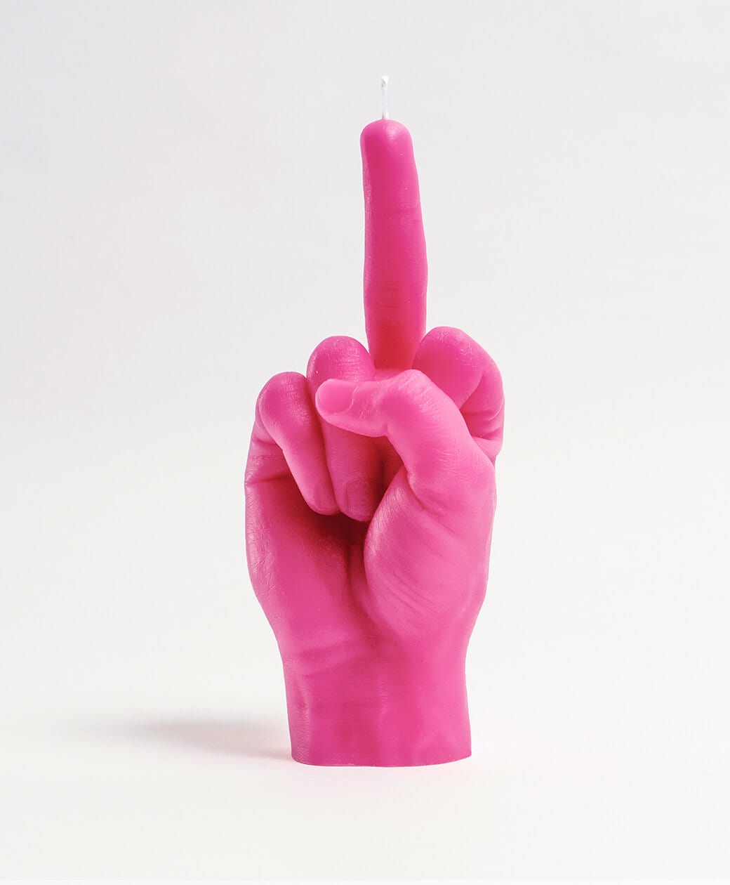 The F*ck You Candle - Pink is a playful, hand-shaped candle with an extended middle finger—perfect for adding bold flair to any space or gifting from your favourite Tallinn concept store. Gate21.ee