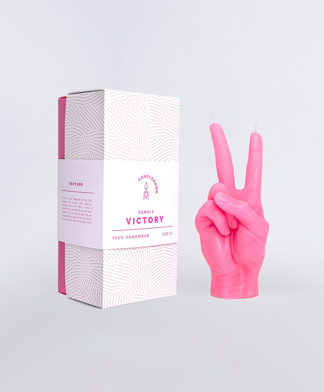 A blue candle shaped like a hand making a peace sign is shown beside a white and pink box labelled Peace Candle - Blue, which features a fingerprint-like pattern and product details—ideal for curated gift shop displays. Gate21.ee