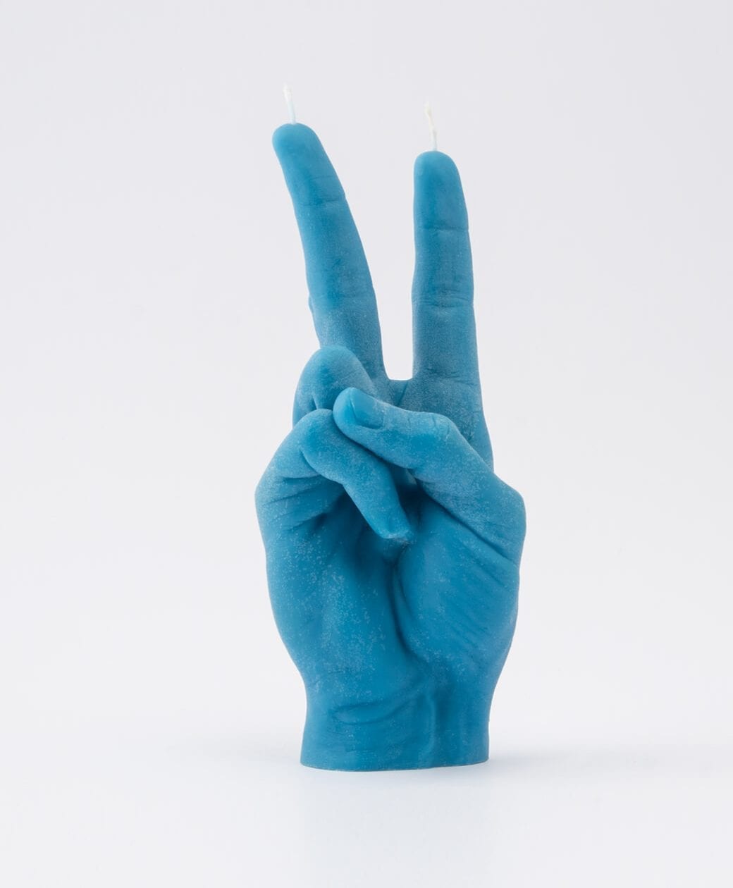 The Peace Candle - Blue features a blue candle shaped like a hand making the peace sign, with two unlit wicks on the raised fingers—a standout gift shop item for those seeking unique décor—displayed against a plain white background. Gate21.ee