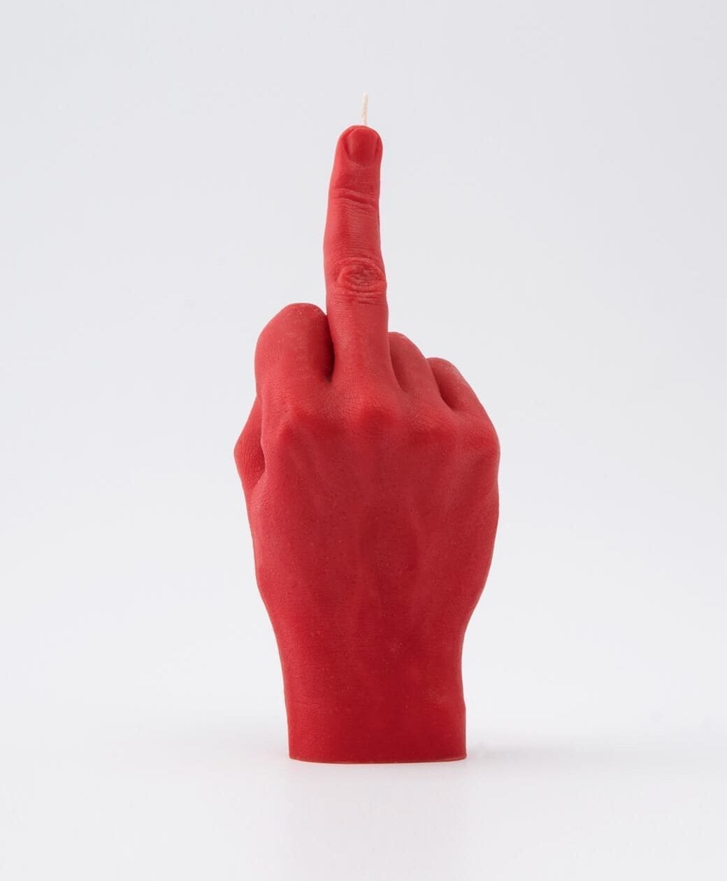 The F*ck You Candle - Red is a bold, Estonian-designed candle shaped like a hand giving the V-sign. Its unique look adds attitude to any gift shop. Candle shown against a plain white background. Gate21.ee