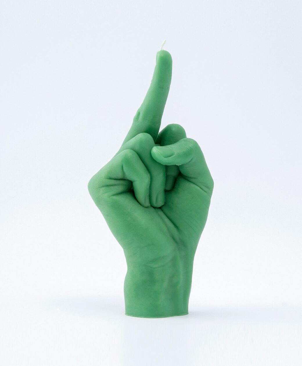 The F*ck You Candle - Green is shaped like a hand with an extended middle finger. Photographed on a plain white background, it’s perfect for adding attitude to your décor or picking up at your favourite Tallinn shopping concept store. Gate21.ee