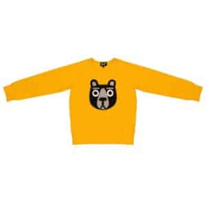 The Kids Bear sweatshirt is a yellow long-sleeve top with a black and white bear face graphic and a small MLP logo on the collar tag, inspired by Estonian design—ideal for unique style from a concept shop. Gate21.ee