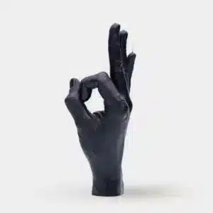 OK – Black is a realistic black sculpture of a human hand making an OK gesture, displayed upright against a light background with thin metal rods extending from its fingertips—an eye-catching piece ideal for any concept shop or Tallinn shopping trip. Gate21.ee