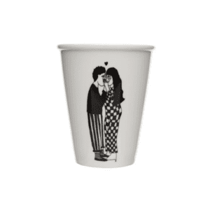 A white mug featuring a black and white illustration of a couple standing close together, facing each other, with a small heart above their heads. Showcasing Estonian design, this piece is perfect for any curated gift shop. The figures wear striped and chequered outfits. Gate21.ee