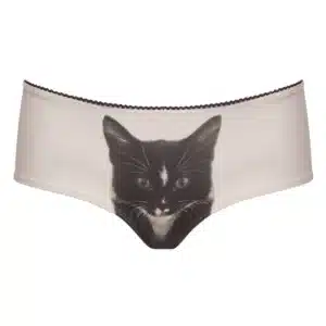 A pair of beige knickers featuring a realistic print of a black and white cat’s face on the front, inspired by playful Estonian design—perfect for those who love unique, curated finds. Gate21.ee