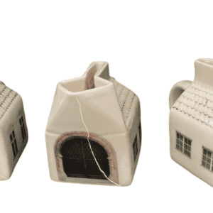Three ceramic creamers shaped like small houses, each with unique windows and doors, white walls, and pitched roofs&mdash;an elegant example of Estonian design. Perfect for display or gifting from your favourite concept store or gift shop. Gate21.ee