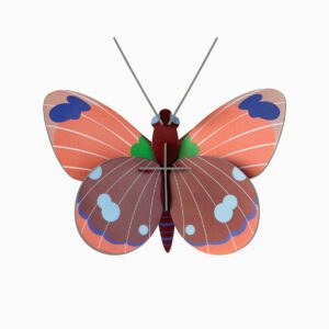 The Delias Butterfly is a vibrant, stylised paper creation with red and pink wings, blue and white spots, green accents near the body, and thin grey antennae—an example of unique Estonian design on a plain white background. Gate21.ee
