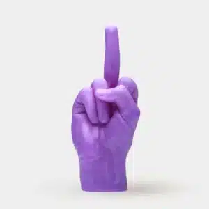 The F*ck You Candle - Purple is shaped like an upright hand with the middle finger extended, shown against a white background—making it a bold, edgy piece for any concept shop or modern gift shop display. Gate21.ee