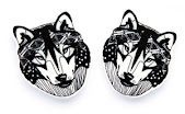 Hundid Kõrvarõngad are black and white wolf head earrings with detailed line work and geometric patterns—an ideal unique accessory to discover whilst shopping in Tallinn. Gate21.ee