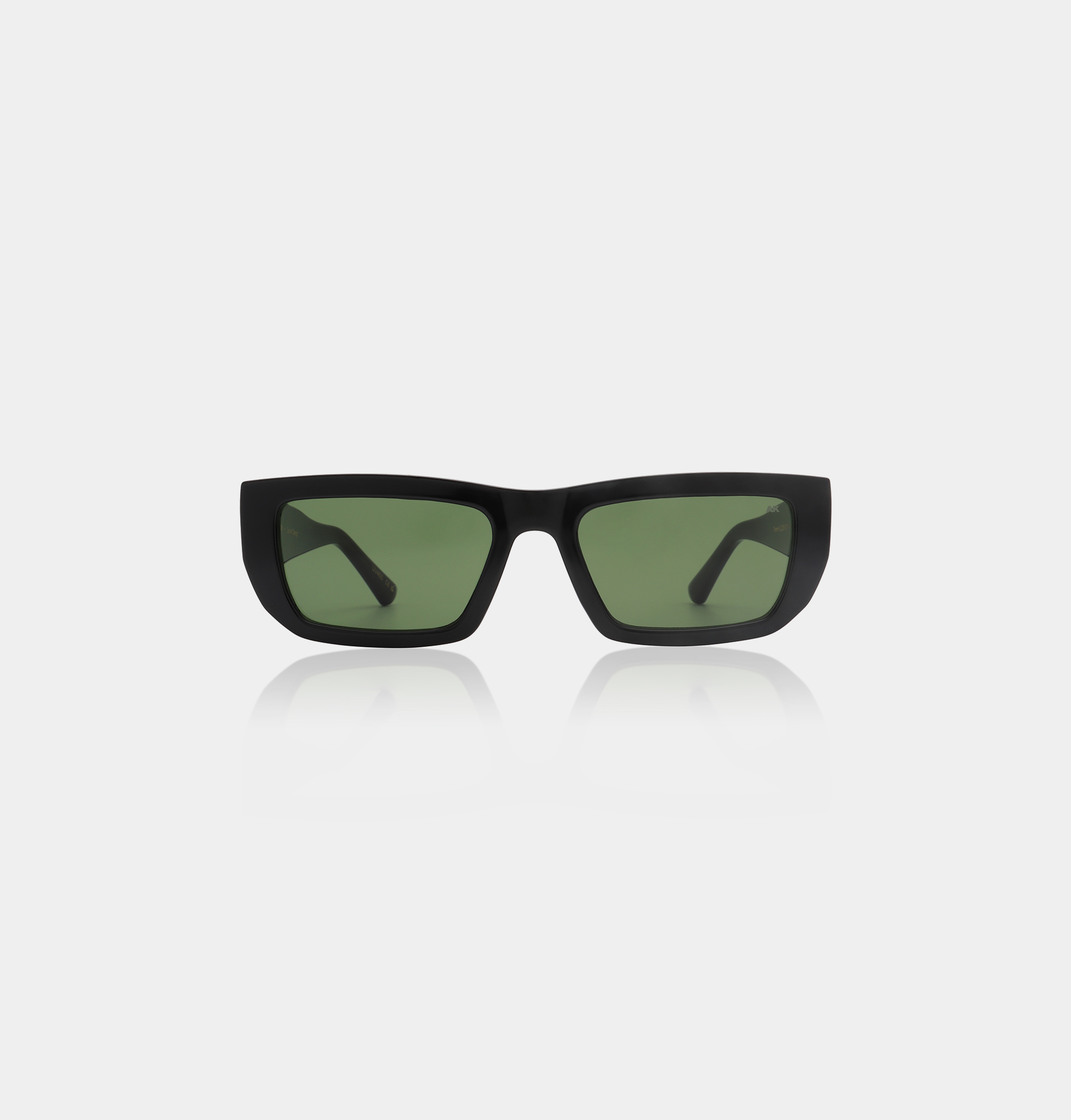 The FAME - Black sunglasses, featuring a rectangular black frame with green-tinted lenses and Estonian design, are displayed on a white background. The partially visible arms complete the stylish look. Gate21.ee
