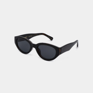 WINNIE - Black: Cat-eye sunglasses with dark lenses and thick frames, showcased at a three-quarter angle on a plain white background—ideal for trendsetters seeking unique style or standout accessories. Gate21.ee
