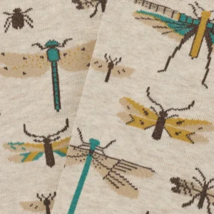 Close-up of "Insects – Regular" beige fabric with printed illustrations of dragonflies, beetles, and winged bugs in yellow, brown, black, and teal—a curated piece for gift shops or Tallinn shopping enthusiasts. Gate21.ee