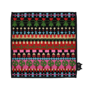 A curated square fabric piece featuring colourful, horizontal rows of floral and geometric patterns on a black background. A small cat face detail appears at the bottom right corner, perfect for those seeking unique ideas. Gate21.ee