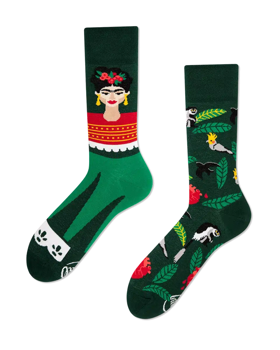 A pair of green socks from our curated gift shop; one features an illustrated woman with red flowers and earrings, the other displays animals and leaves in vibrant colours on a dark green background—perfect for those seeking unique ideas. Gate21.ee