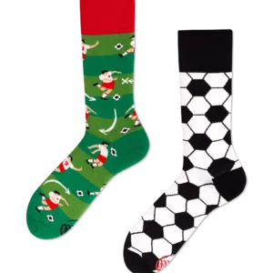 A pair of mismatched socks: one green with cartoon football players and red trim, the other white with a black football pattern and black trim, both on a black background—a curated find for those seeking unique ideas from Tallinn shopping. Gate21.ee