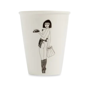 The "Pin-up Cake Girl" white cup from the concept shop features a black line drawing of a woman in striped socks, apron, and short hair holding a tray and bag—a unique gift shop idea. Gate21.ee