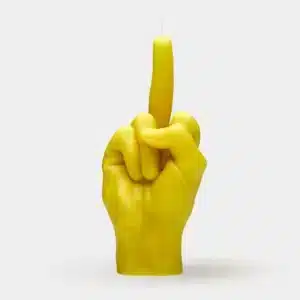 The F*ck You Candle - Yellow is a bold, hand-shaped candle with an extended middle finger and wick at the tip—an edgy accent for concept shops or a standout piece for unique shopping in Tallinn. Gate21.ee