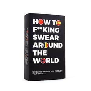 A black box with bold white text reads “How to Swear around the World - Card Game,” featuring flag icons in some letters. Includes 100 cards—an edgy and fun pick for gift shops or your next Tallinn shopping trip. Gate21.ee