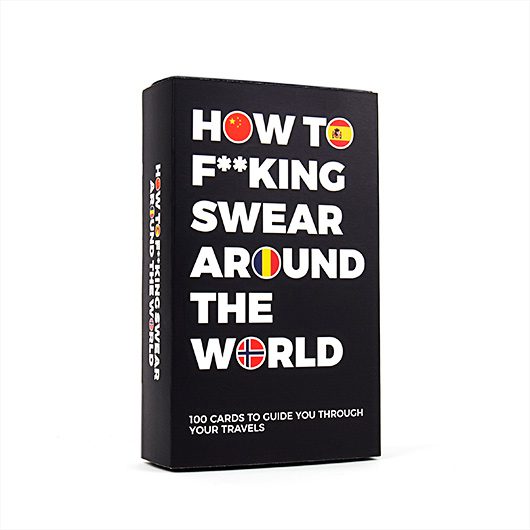 A black box with bold white text reads “How to Swear around the World - Card Game,” featuring flag icons in some letters. Includes 100 cards—an edgy and fun pick for gift shops or your next Tallinn shopping trip. Gate21.ee