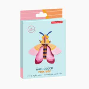 A pastel blue box displays the Pink Bee—a colourful 3D wall decor, ideal for unique ideas or as an Estonian design gift. The packaging reads WALL DECOR PINK BEE and studio ROOF, with a description at the bottom. Gate21.ee