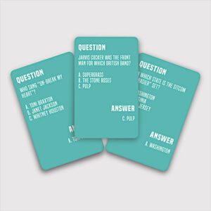 Three teal cards from the Totally 90's - Trivia Card Game are displayed with questions, three answer choices, and the correct answer at the bottom—all spread out on a white background, ideal for a concept store or gift shop display. Gate21.ee