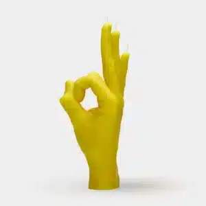 The OK - Yellow candle is shaped like a hand making an OK gesture in vibrant yellow—an eye-catching piece to add character and flair to any concept shop or gift shop display. Gate21.ee