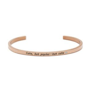 The "Cute, but psycho..but cute" rose gold open bangle features engraved text and a clear gemstone accent—an eye-catching piece for concept shops or your next Tallinn shopping adventure. Gate21.ee