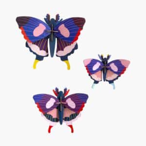 Butterflies (Set of 3): Three geometric butterfly models with layered wings in blue, purple, pink, red, and yellow patterns are displayed on a white background—an ideal decorative piece for concept shops. Gate21.ee