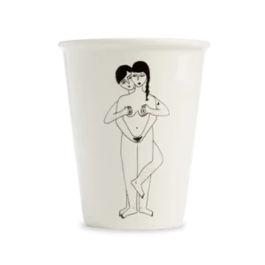 The Faces Cup is a white cup featuring a black line drawing of two nude figures, one standing behind the other with hands covering the front figure’s breasts and genitals—an eye-catching Estonian design suitable for any concept shop. Gate21.ee
