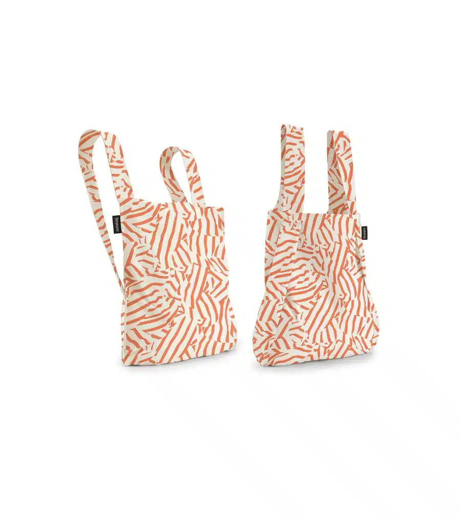 The Peach Twist reusable tote bags feature orange abstract stripes on white, double handles, and black logo tags—an ideal, eye-catching choice for concept shops seeking unique designs. Gate21.ee