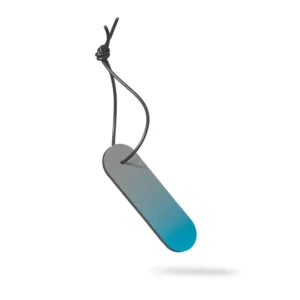 The Dangle - Long - Blue Fade is a flat, rounded rectangular tag with a grey-to-blue gradient that hangs from a black knotted cord. Ideal for Tallinn shopping or gift shop displays, it is shown suspended over a white background with a faint shadow. Gate21.ee