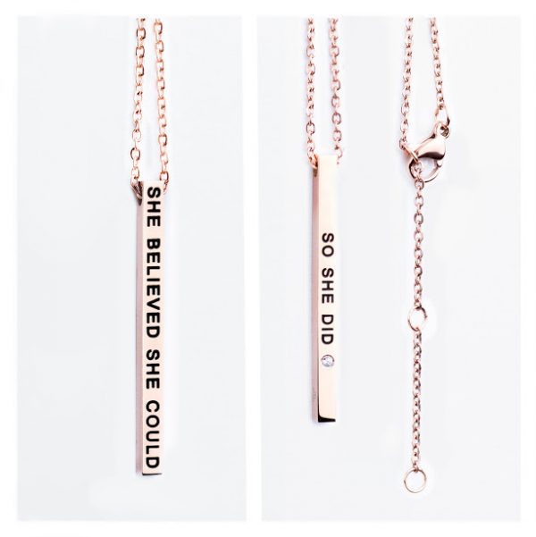 Two images of our "She believed She could / so She did" rose gold vertical bar necklace. Features engravings on each side, a lobster clasp, and an adjustable chain—an inspiring gift from our curated shop. Gate21.ee