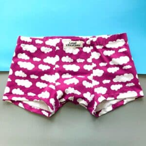 Good Vibrations - Boxer shorts - KÕIK: Purple boxer briefs with a white cloud pattern and "Good Vibrations" on the waistband, shown on a blue and grey background—ideal for standout gift shop finds. Gate21.ee
