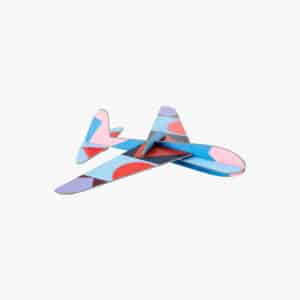 The Giant Glider Plane is a foam toy aeroplane featuring a geometric pattern in blue, pink, purple, and red—ideal for gift shops or concept stores in Tallinn shopping districts. Displayed against a plain white background. Gate21.ee